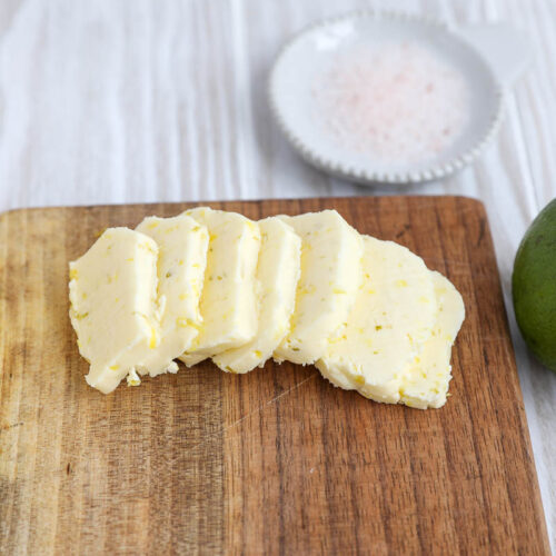 An image of citrus butter on a wooden board.