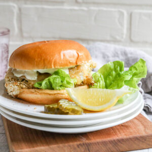 An image of a fish sandwich with pickles