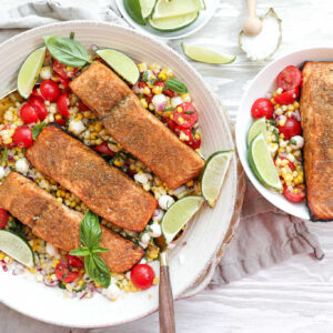 An overhead image of grilled salmon with corn salad