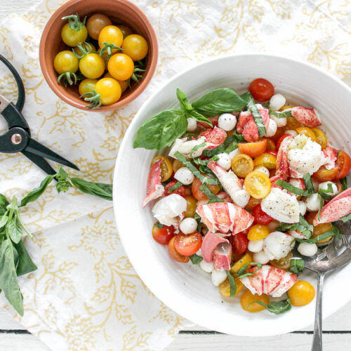 An overhead image of a lobster caprese salad recipe