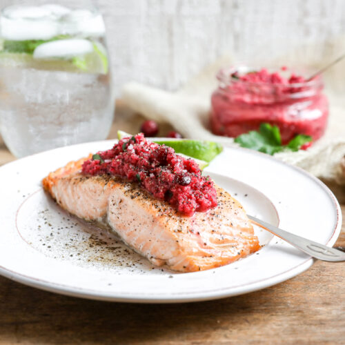 An image of a salmon filet with cranberry relish.