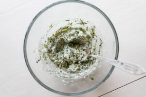 An overhead image of a garlic herb butter for oysters