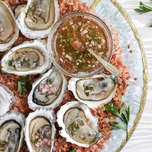 An image of raw oysters with mignonette