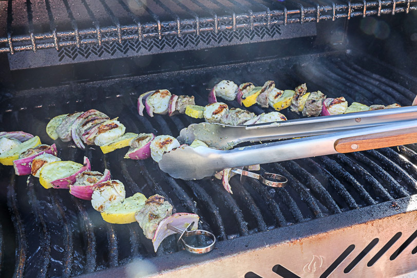 Steak and scallop kabobs on the grill.