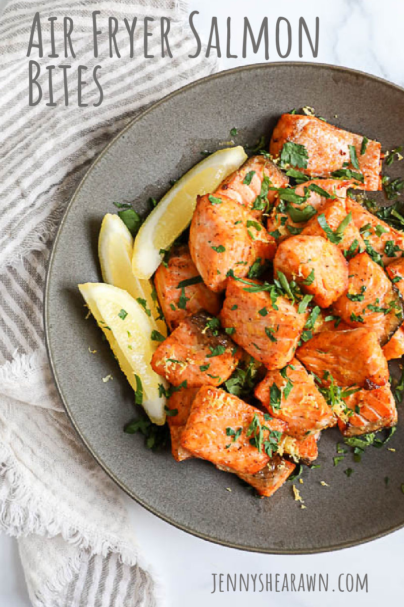 An image of air fryer salmon bites with parsley and lemon zest with text that says Air Fryer Salmon Bites. 