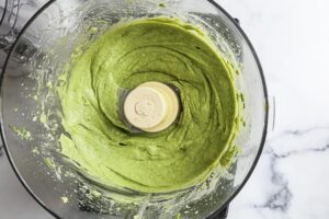 An image of avocado crema in a food processor