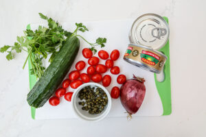 An image of ingredients needed to make tuna salad with capers.