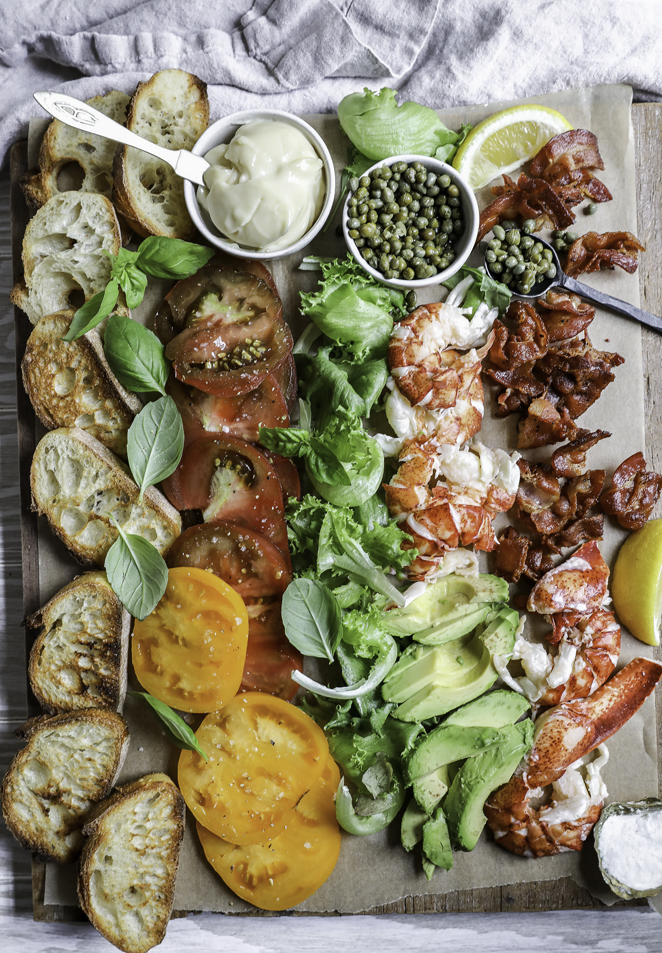 An overhead image of a lobster blt board