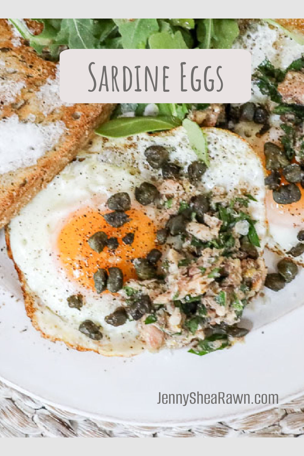 An image of a sardine and eggs recipe on a white plate. 