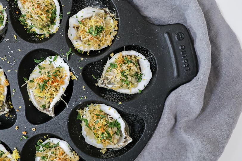 An overhead image of roasted oysters.