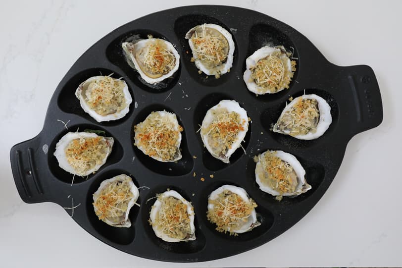 An image of oysters topped with breadcrumbs. 