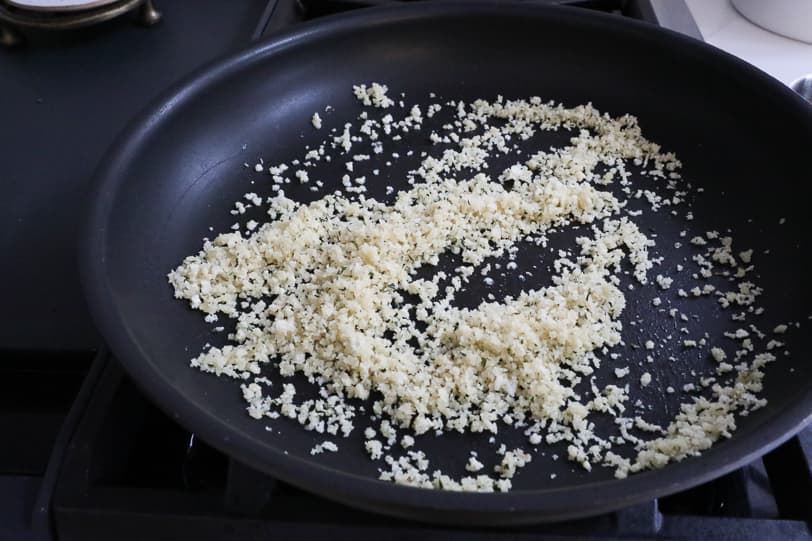 An image of panko toasting in a skillet.