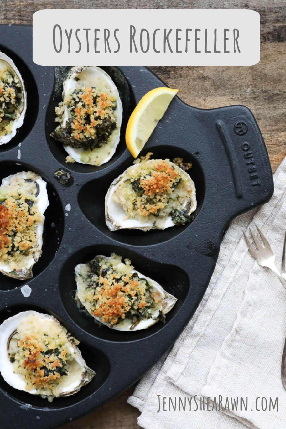 An overhead image of an oysters rockefeller recipe cooked in a cast-iron oyster pan. 