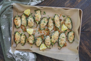 An overhead image of crab jalapeno poppers on a baking sheet. 